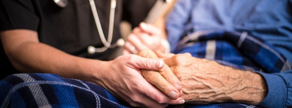 Healthcare Professional And Senior Hands