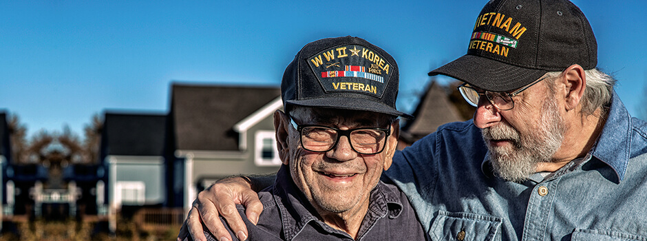 Two Veterans Smiling With Their Arms Around Each Other