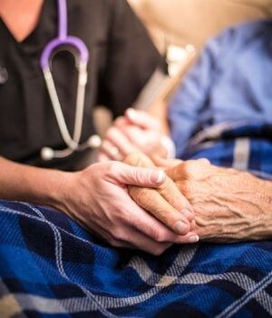 Healthcare Professional And Senior Hands