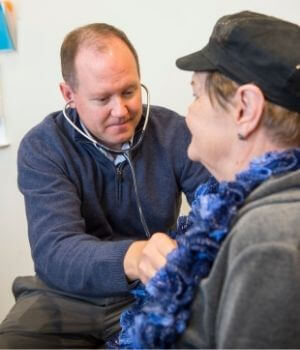 Provider Giving Senior A Medical Examination