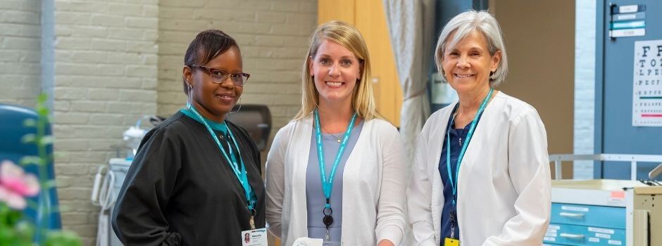 Three Members Of InnovAge Clinical Staff Standing And Smiling