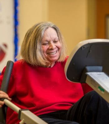 senior participates in clinical exercise with PACE specialist